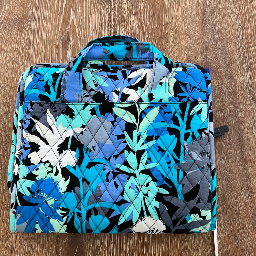 Vera Bradley folding toiletry bag with hook.